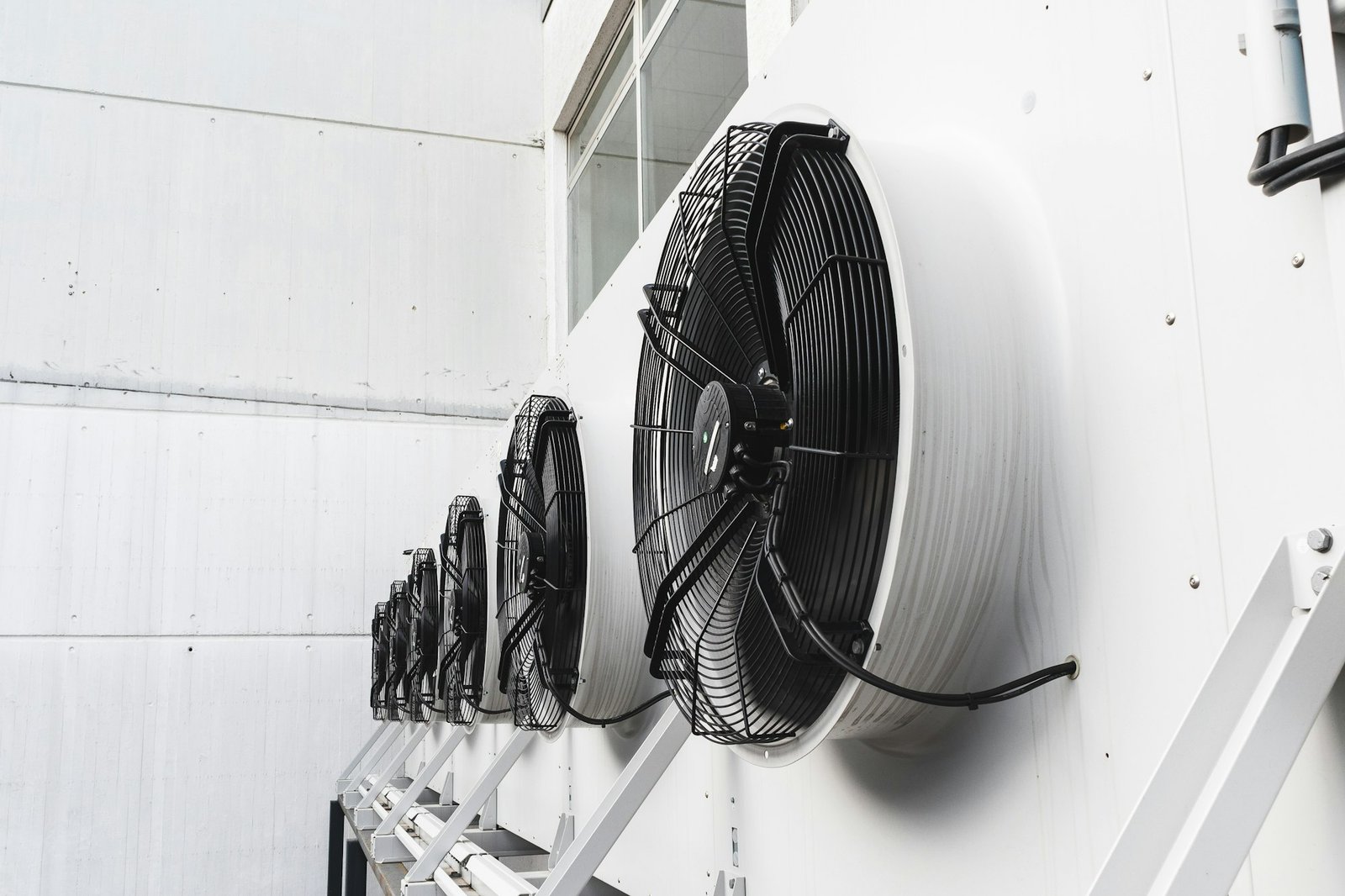 air-conditioner-units-hvac-attached-to-an-industrial-building, home maintenance services in riyadh